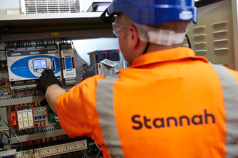 Stannah factory worker working on a stairlift rail