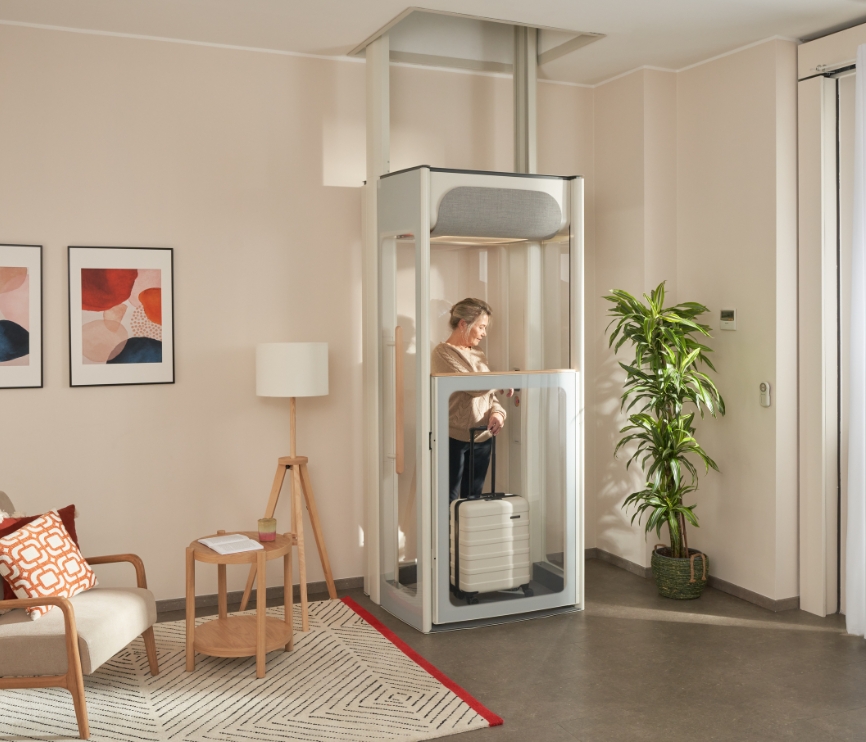 Middle age woman on her Stannah Uplifts S2 homelift