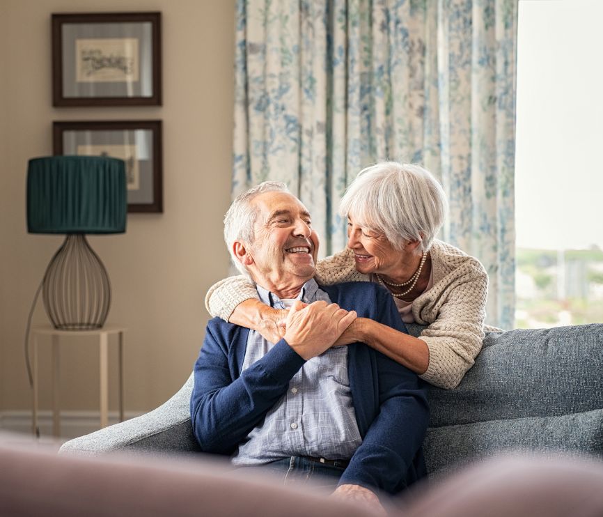 Happy independent couple in their home